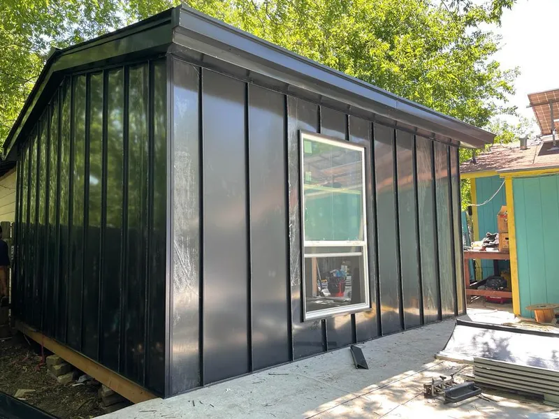 Black standing seam metal wall panels for Roof Inspection in Pittsford