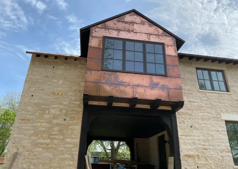 Copper metal panel facade on a stone building for Metal Roof Coating in Pittsford