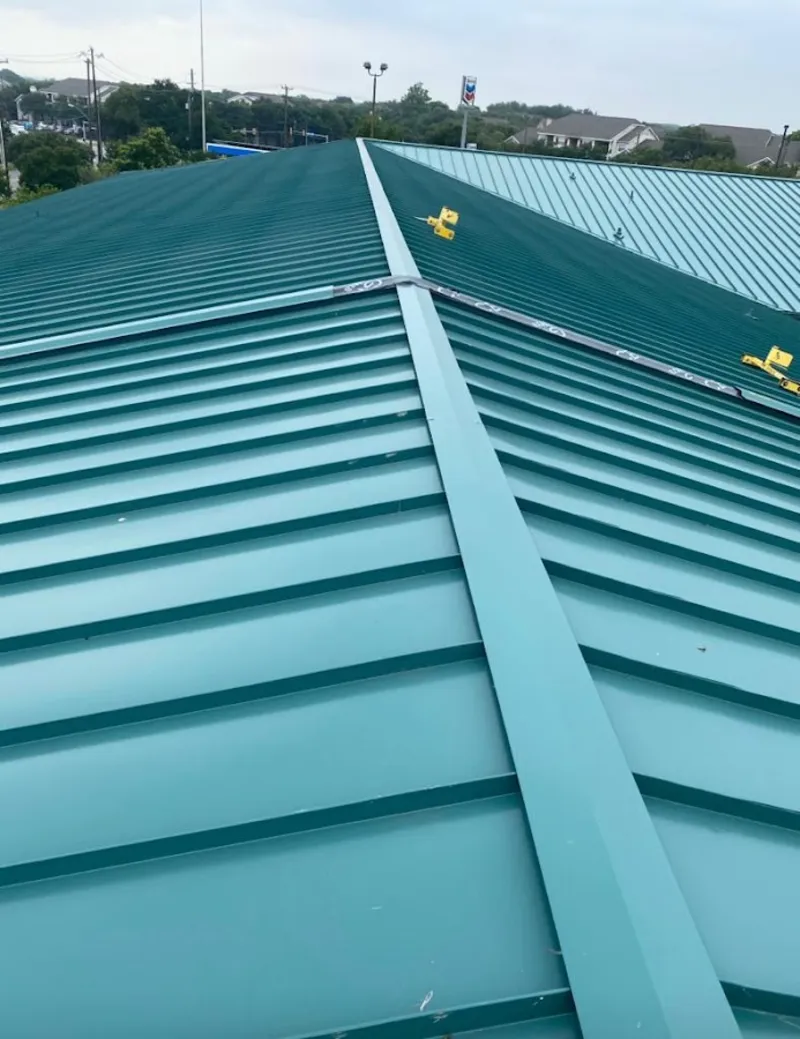Green commercial metal roof ridge and valley for Metal Roof Repair in Pittsford